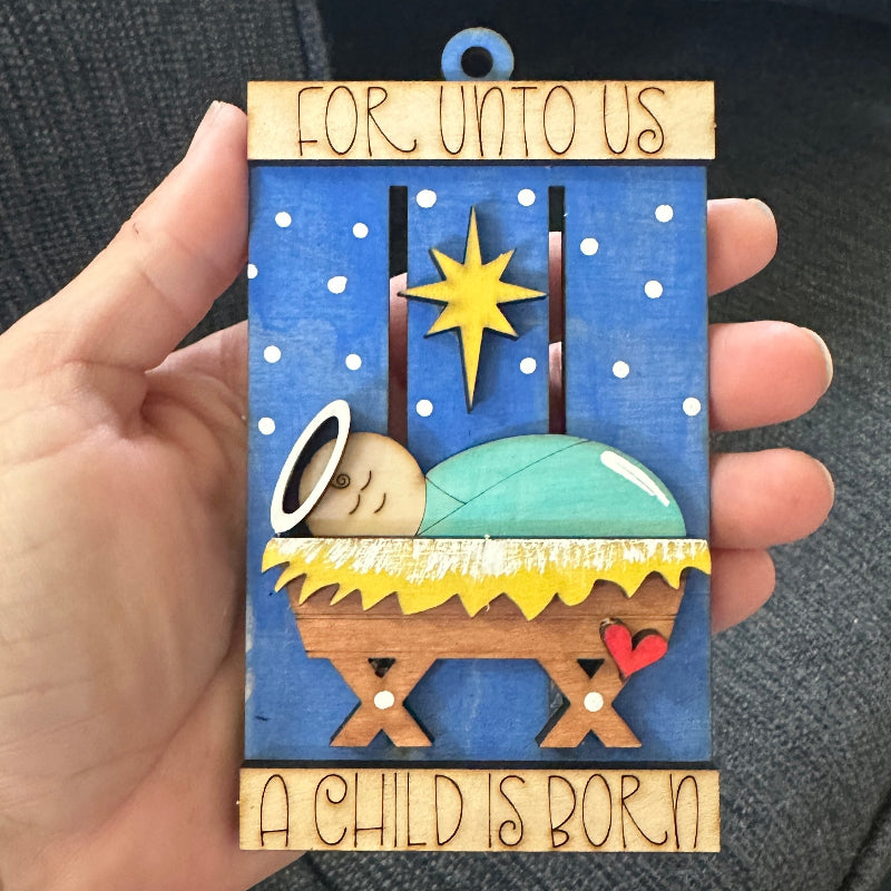 Decorative nativity scene with baby Jesus in a manger