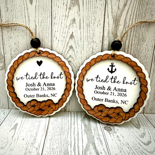 we tied the knot ornament with braided design and personalized text on a wooden background for wedding